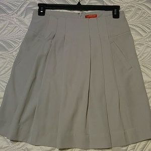 A lovely knee-length pleated skirt.